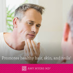 Man looking in mirror at healthy skin and hair - Amy Myers MD®
