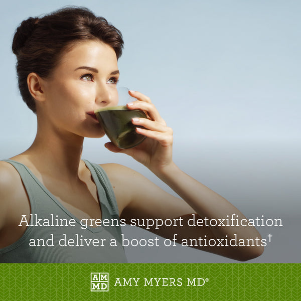 A woman drinks a glass of Organic Greens - Alkaline Greens support detoxification - Amy Myers MD