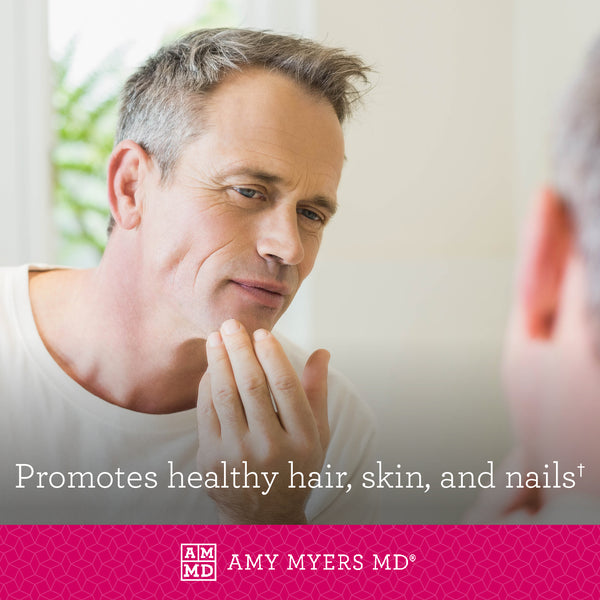 A man looking in mirror at healthy skin and hair - Amy Myers MD®