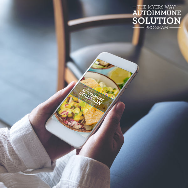 A Woman views The Autoimmune Solution Recipes on a smart phone - Amy Myers MD®